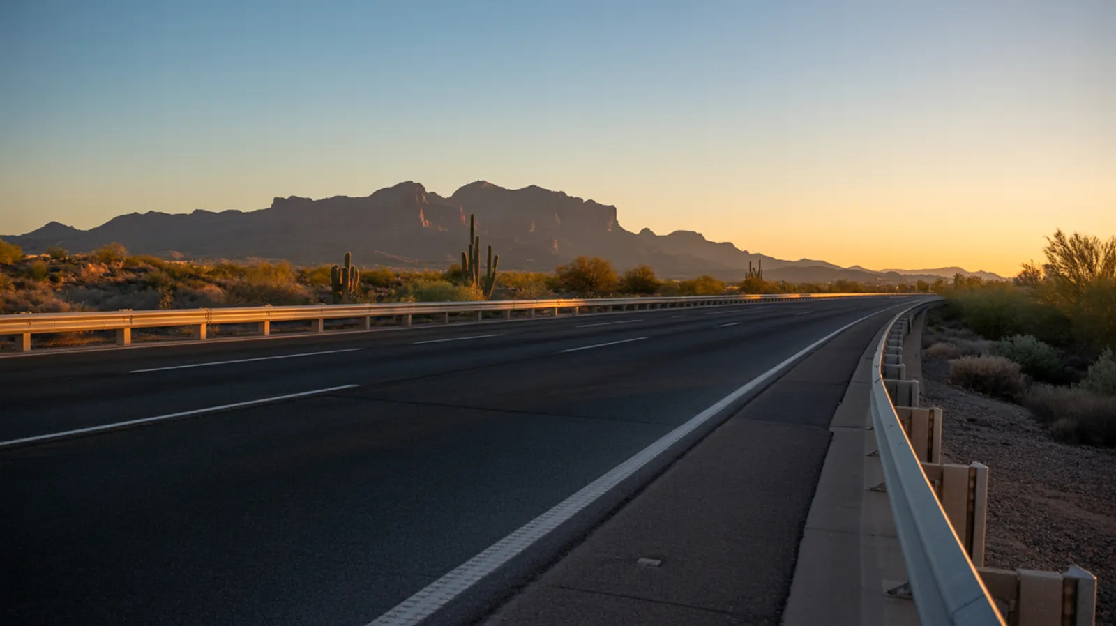 East Valley Arizona freeway corridor at sunrise with the Superstition Mountains on the horizon